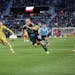 Minnesota United forward Teemu Pukki (22) pounces on the counterattack with Real Salt Lake center back Justen Glad (15) in pursuit Saturday night at A