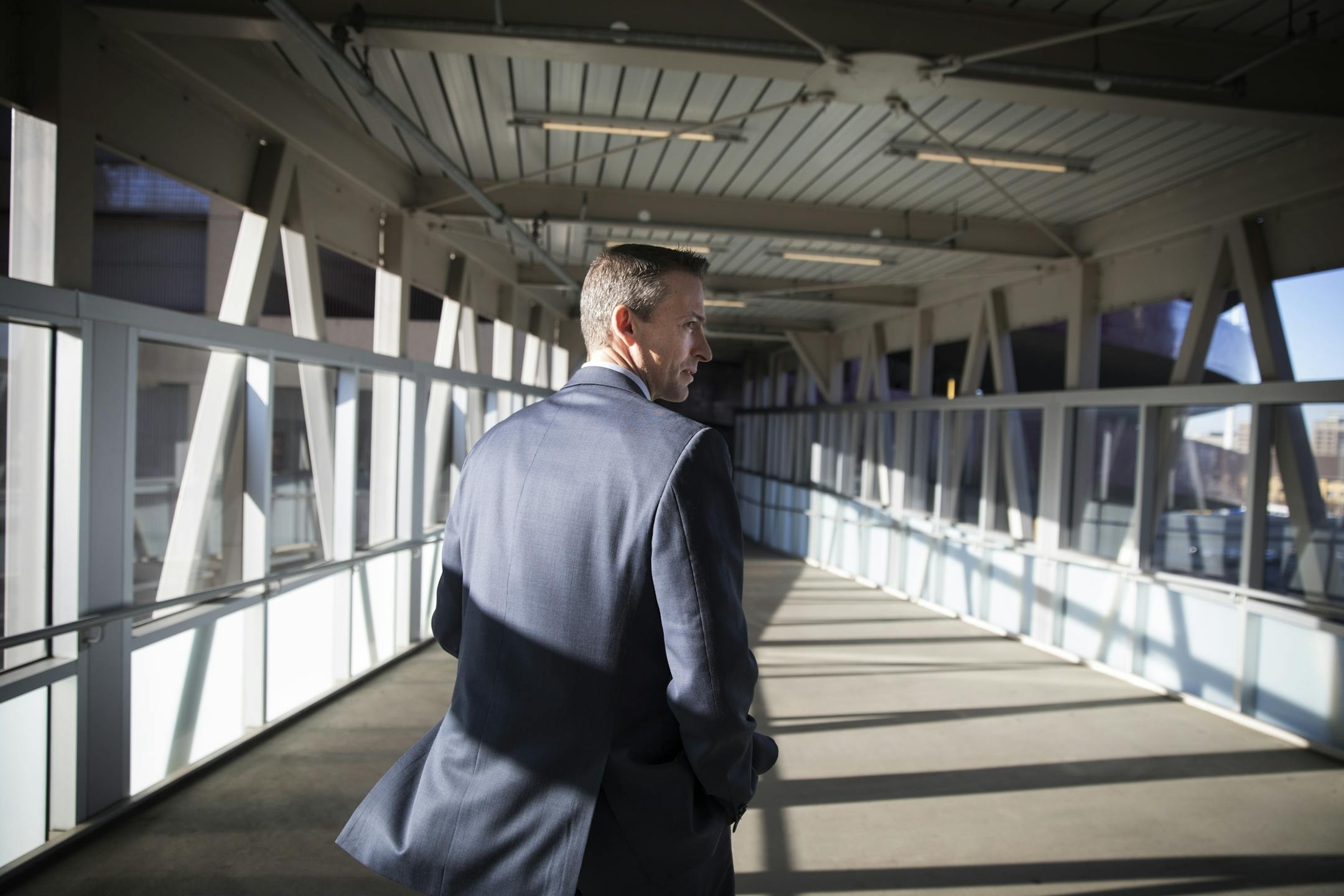 Ed Graff leaves the STEP-UP Achieve Partners Breakfast at Target Field, heading to a full morning of school visits.