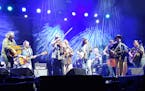 Trampled by Turtles’ members all joined in for Wilco’s finale “California Stars” at Treasure Island Casino Amphitheater on Saturday.