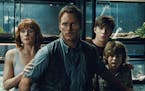 This photo provided by Universal Pictures shows, Bryce Dallas Howard, from left, as Claire, Chris Pratt as Owen, Nick Robinson as Zach, and Ty Simpkin