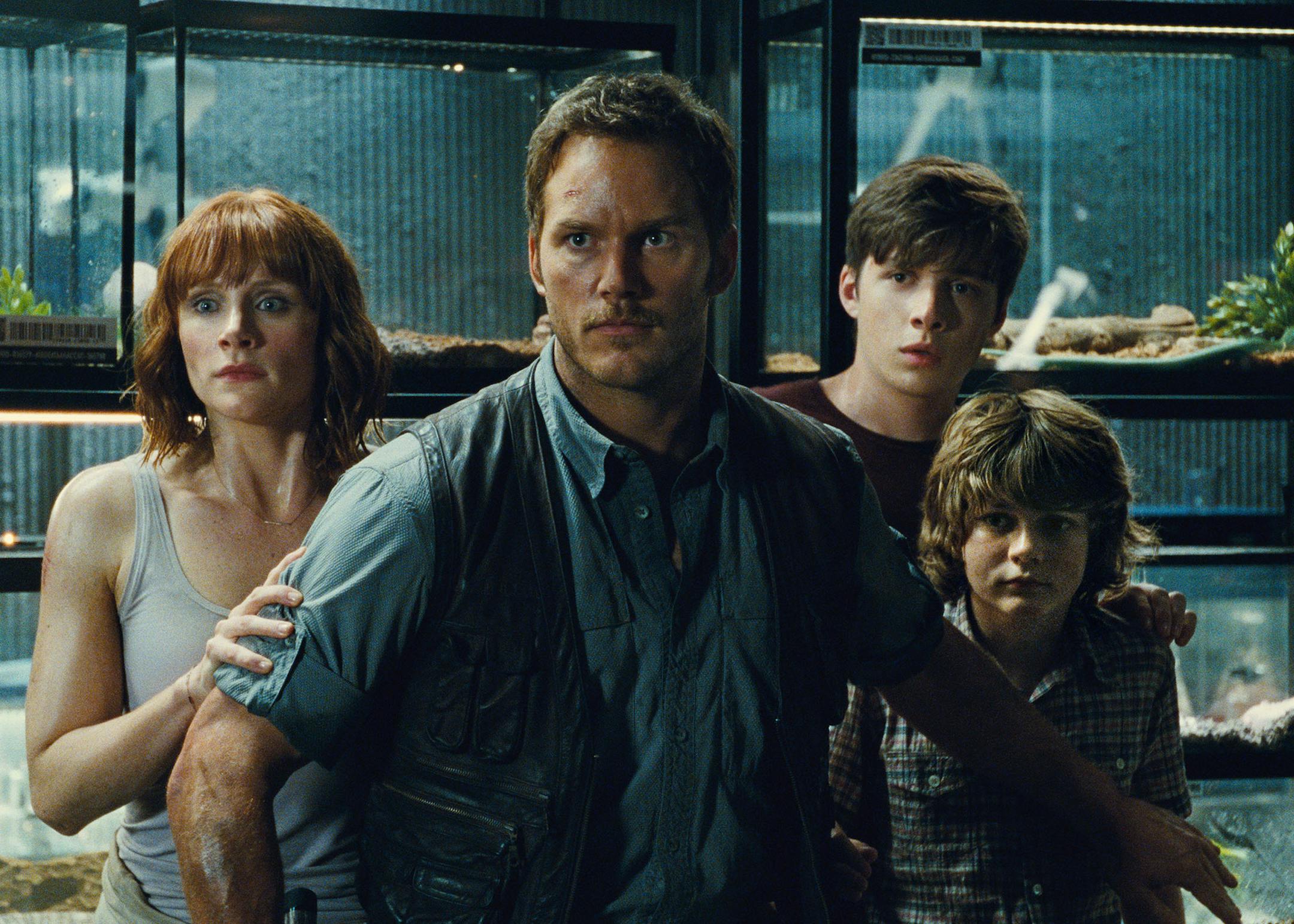 This photo provided by Universal Pictures shows, Bryce Dallas Howard, from left, as Claire, Chris Pratt as Owen, Nick Robinson as Zach, and Ty Simpkins as Gray, in a scene from the film, "Jurassic World," directed by Colin Trevorrow, in the next installment of Steven Spielberg's groundbreaking "Jurassic Park" series. The Universal Pictures 3D movie releases in theaters on June 12, 2015. (Universal Pictures/Amblin Entertainment via AP)