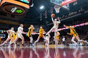 Gophers guard Amaya Battle (3) lays the ball in against North Dakota State in the first quarter Friday at Williams Arena.