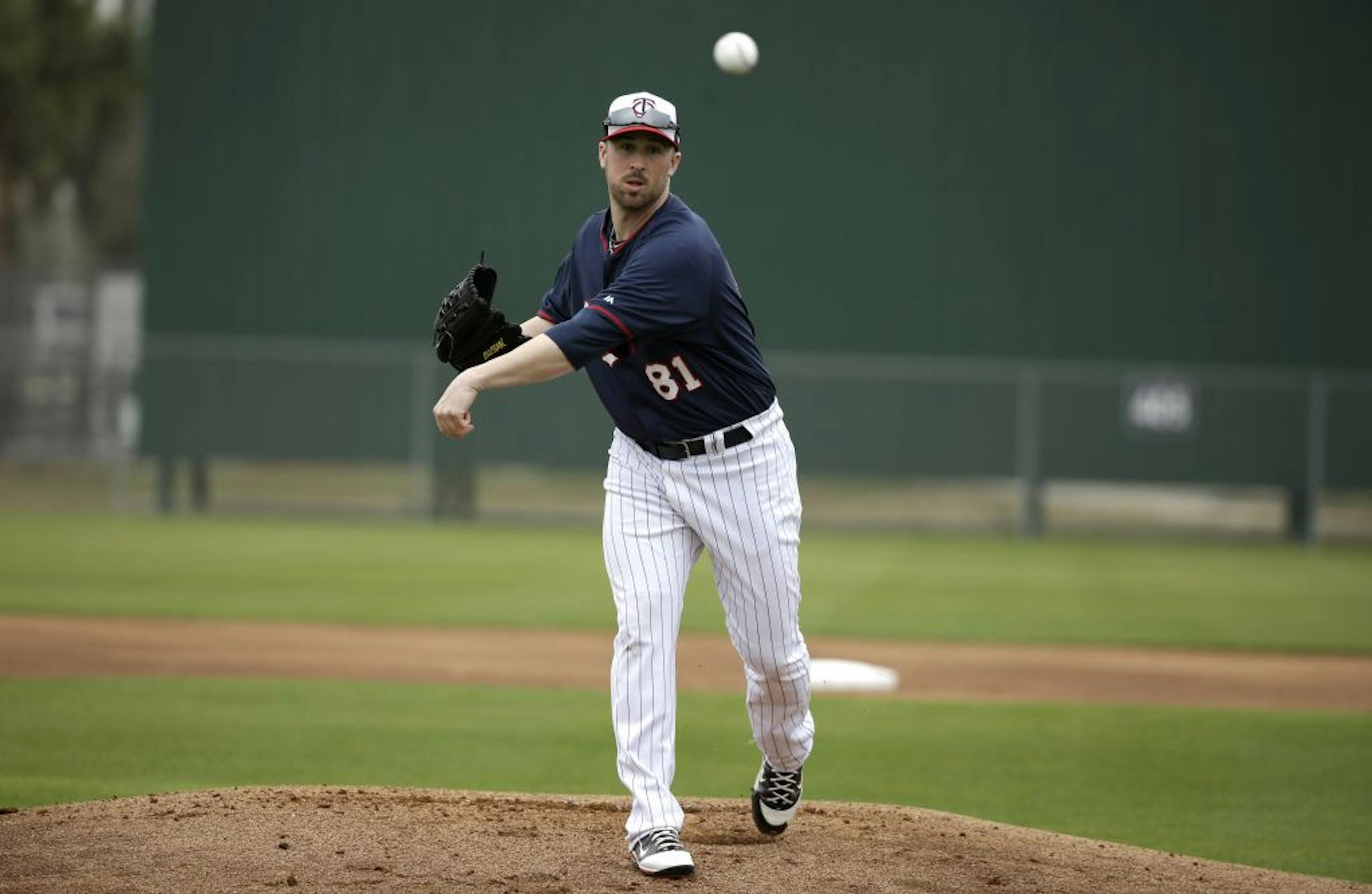 Minnesota Twins pitcher Matt Hoffman delivers a throw during spring training baseball practice Tuesday, Feb. 25, 2014, in Fort Myers, Fla.