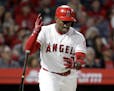 Los Angeles Angels' Justin Upton reacts after flying out against the Minnesota Twins during the 11th inning of a baseball game in Anaheim, Calif., Sat