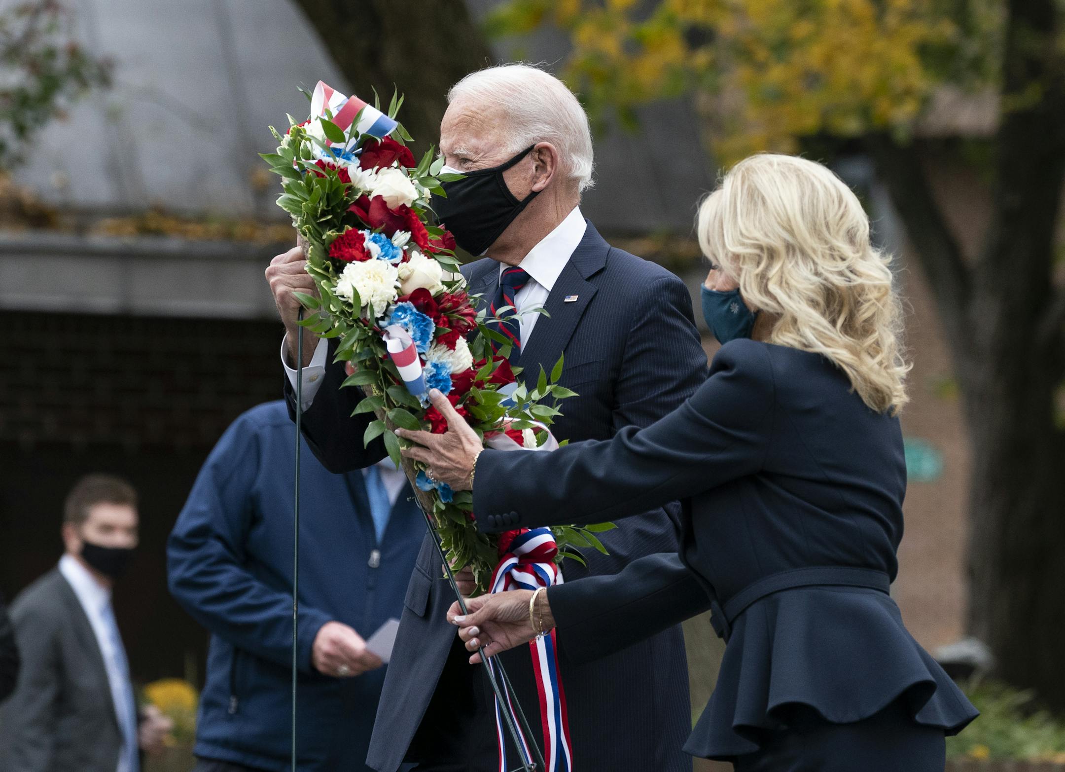 President-elect Joe Biden, and Jill Biden, place a wreath at the Philadelphia Korean War Memorial at Penn's Landing, on Veterans Day, Wednesday, in Philadelphia.