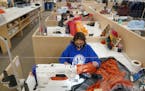 Sewer Natalie Armstrong stitched a custom sleeping quilt at her workstation Thursday.