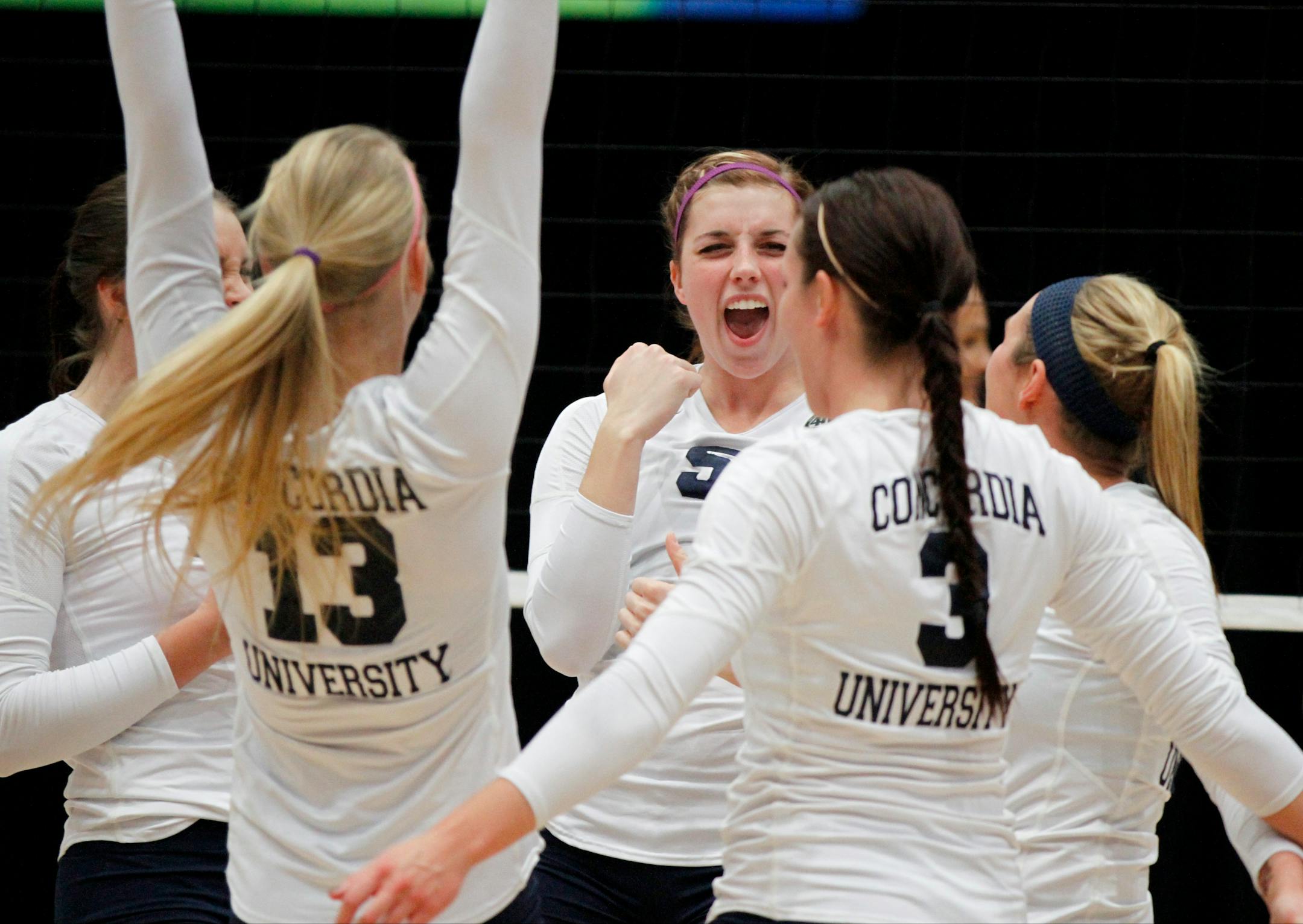 Freshman Riley Hanson, center, celebrates with Concordia teammates during Saturday's Division II championship volleyball match. (Conrad Schmidt/NCAA Photos