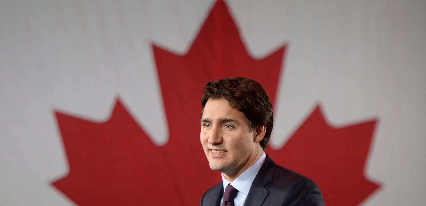 Liberal leader Justin Trudeau stands on stage at the Liberal party headquarters in Montreal, Tuesday, Oct. 20, 2015. Trudeau, the son of late Prime Minister Pierre Trudeau, became Canada&#xed;s new prime minister after beating Conservative Stephen Harper. (Sean Kilpatrick/The Canadian Press via AP) MANDATORY CREDIT ORG XMIT: MIN2015102012474434