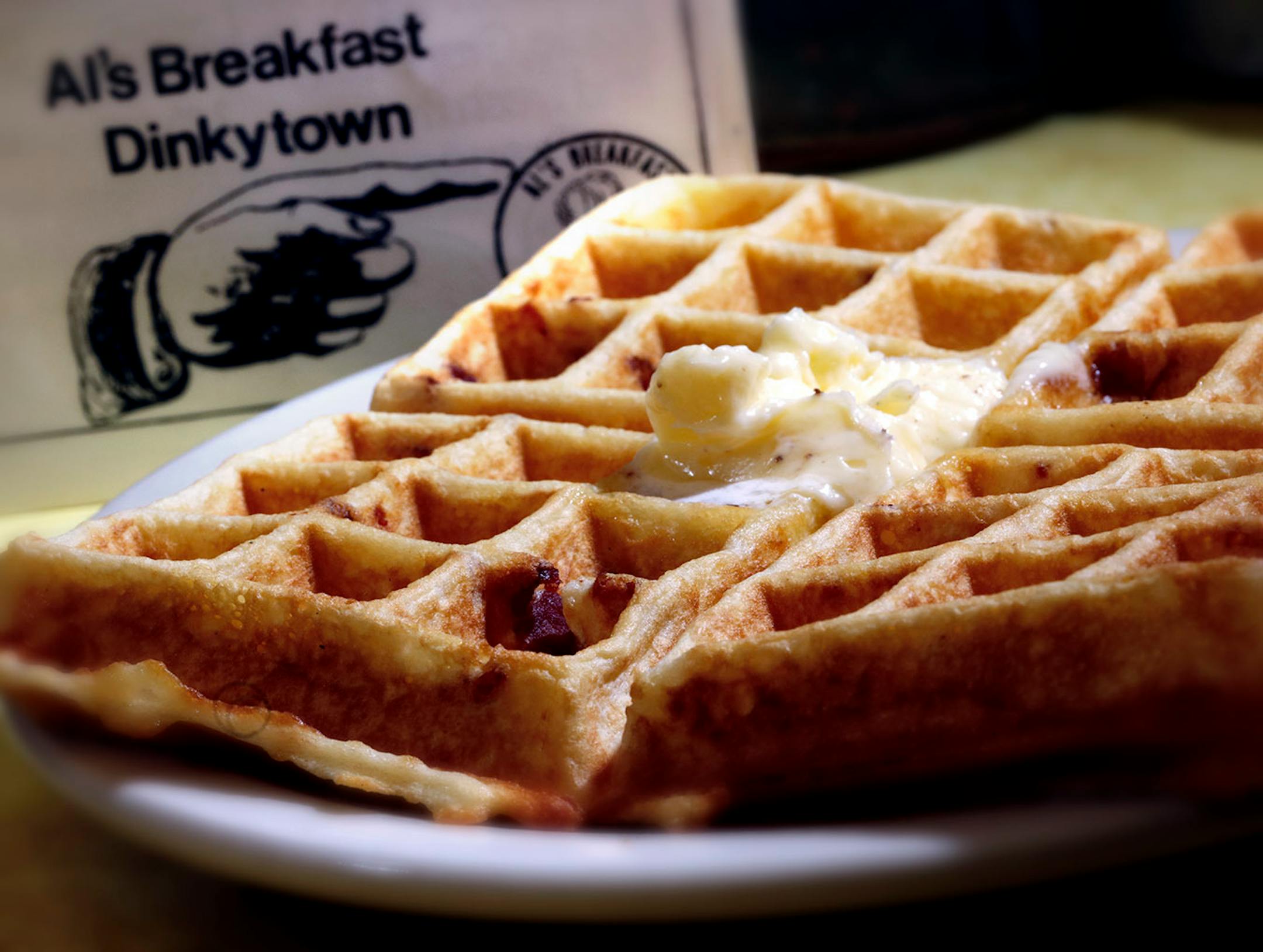 Bacon waffle. A changing of the guard at the institution, Al's Breakfast. Doug Grina, one of the original owners and Alison Kirwin, his new partner, at the tiny 14-seat restaurant. Some of the food they are famous for are dishes like the, blueberry/walnut pancakes, bacon waffle, and the "Jose."