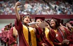 Graduating students at St. Paul's Harding High School take a selfie during their 2023 graduation ceremony.
