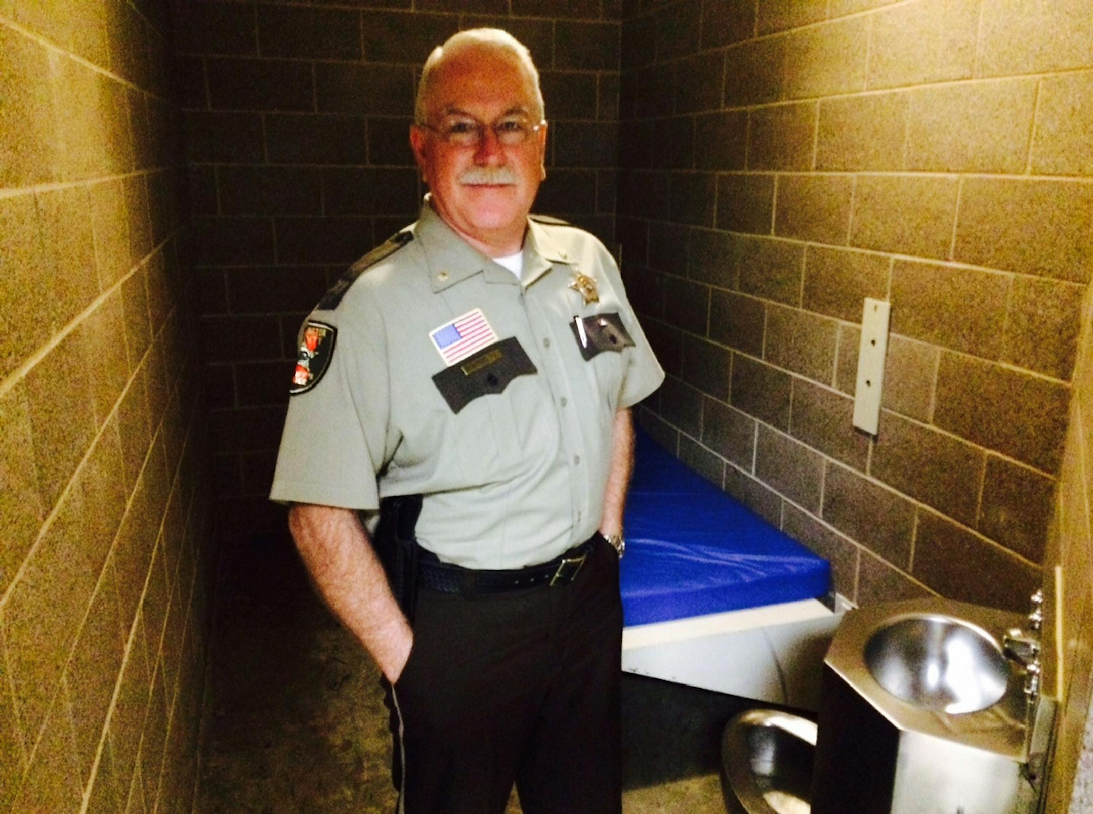 Chuck Yetter, now-retired commander of the Washington County jail, worked in three Minnesota prisons before joining the Sheriff&#x2019;s Office. Working with prisoners, he said, requires high ethical and moral standards. He&#x2019;s shown in a holding cell in the jail.