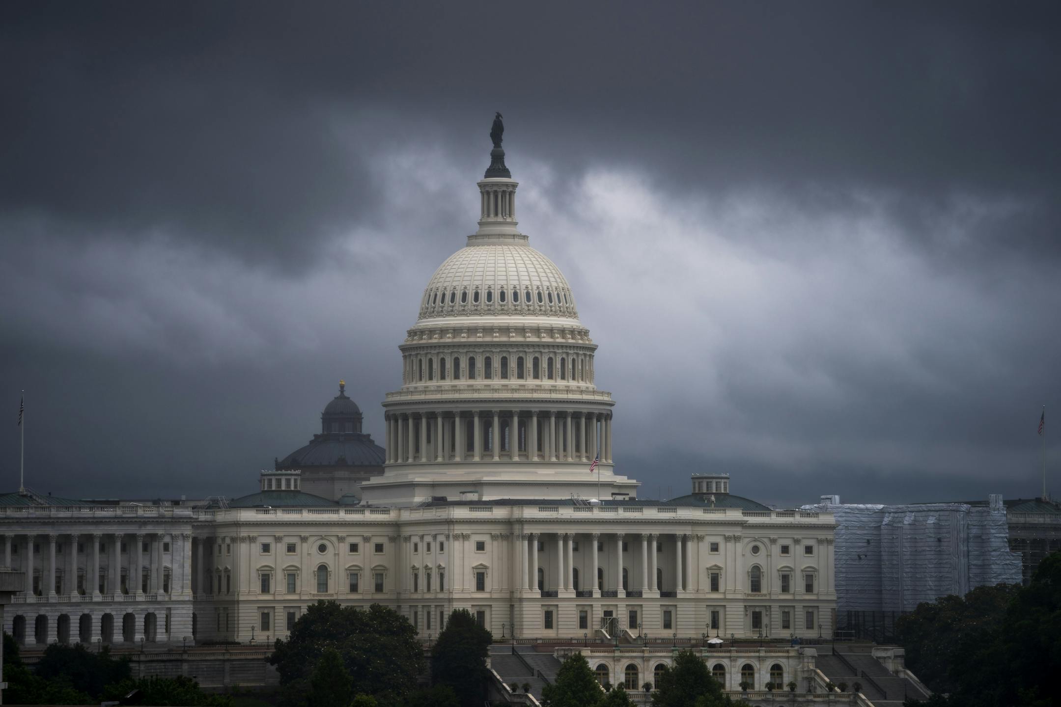 Rain clouds pass over the U.S. Capitol as seen from the Canadian Embassy on Pennsylvania Avenue in Washington, Thursday, June 13, 2019. (AP Photo/J. Scott Applewhite)