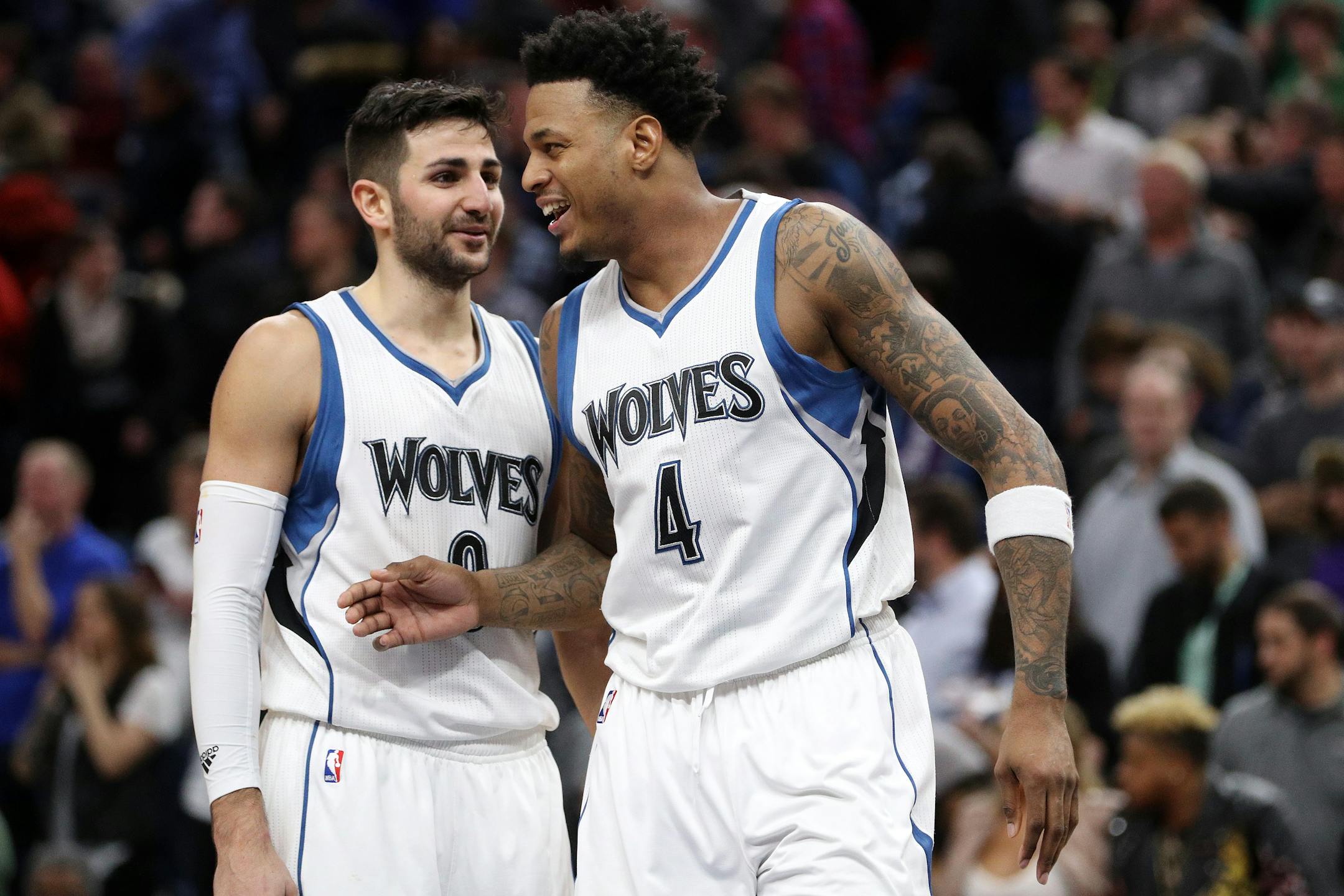 The Minnesota Timberwolves' Ricky Rubio celebrates with teammate Brandon Rush after a 96-86 win against Oklahoma City.