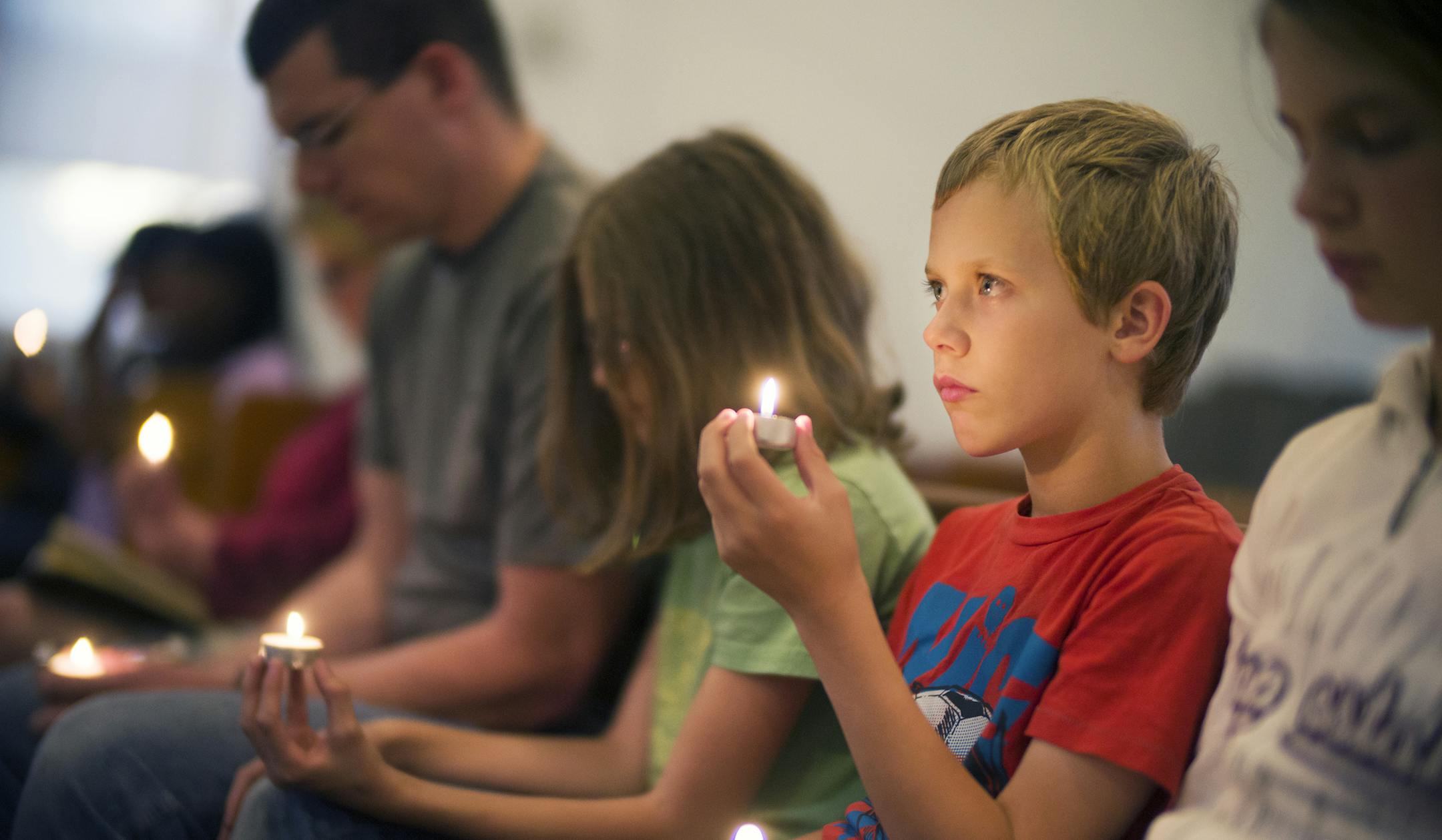 At Holsey Memorial CME Church where a vigil was held for the three children who died in house fire, Joel Davis,10, came with siblings Lydia,11, Abigail,13, and his father Joel to remember the friends.