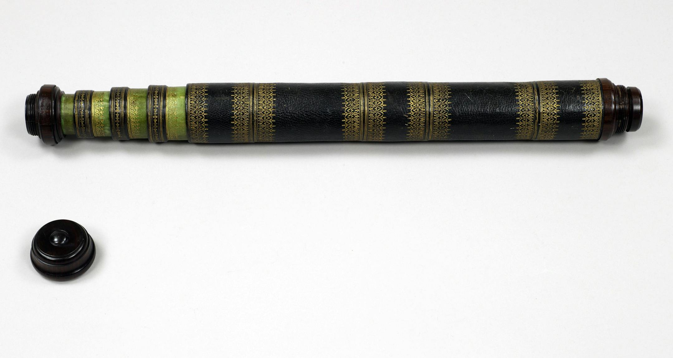 In this Oct. 8, 2008, photo provided by the Adler Planetarium in Chicago, a five foot long telescope made by Philippe-Claude LeBas, the optician to French King Louis IV is shown. Dating back to around 1670, the instrument is constructed of paper covered with Moroccan leather. The device is part of historic telescope collection belonging to Marvin Bolt, the science and technology curator at New York’s Corning Museum of Glass. (AP Photo/Adler Planetarium, Steve Pitkin)