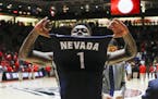 Nevada's Marcus Marshall (1) celebrates his team's win following the end of an NCAA college basketball game against New Mexico in Albuquerque, N.M., S