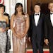 President Barack Obama and first lady Michelle Obama pose for a photo as they greet Italian Prime Minister Matteo Renzi and his wife Agnese Landini on