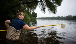 Monitoring coordinator Sarah Jo Schmitz, with the Sauk River Watershed District, took a water sample from the Mississippi River at Sauk Rapids Municip