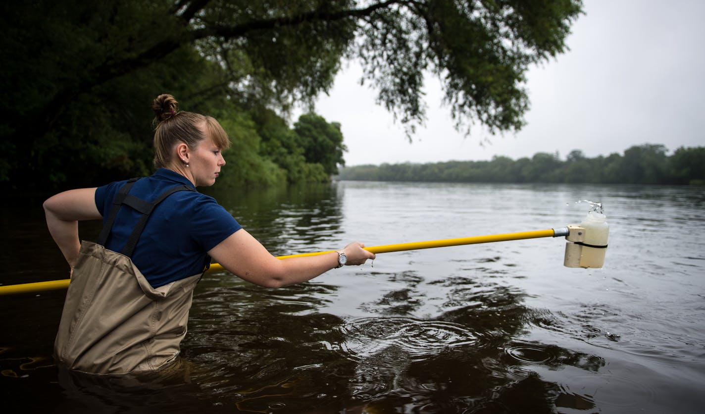 Monitoring coordinator Sarah Jo Schmitz, with the Sauk River Watershed District, took a water sample from the Mississippi River at Sauk Rapids Municipal Park in early August. Schmitz regularly tests the water for pollutants and bacteria. ] (AARON LAVINSKY/STAR TRIBUNE) aaron.lavinsky@startribune.com RIVERS PROJECT: We look at three of Minnesota's rivers, including the Mississippi, Red and Chippewa, to see how land use effects water quality and pollution.