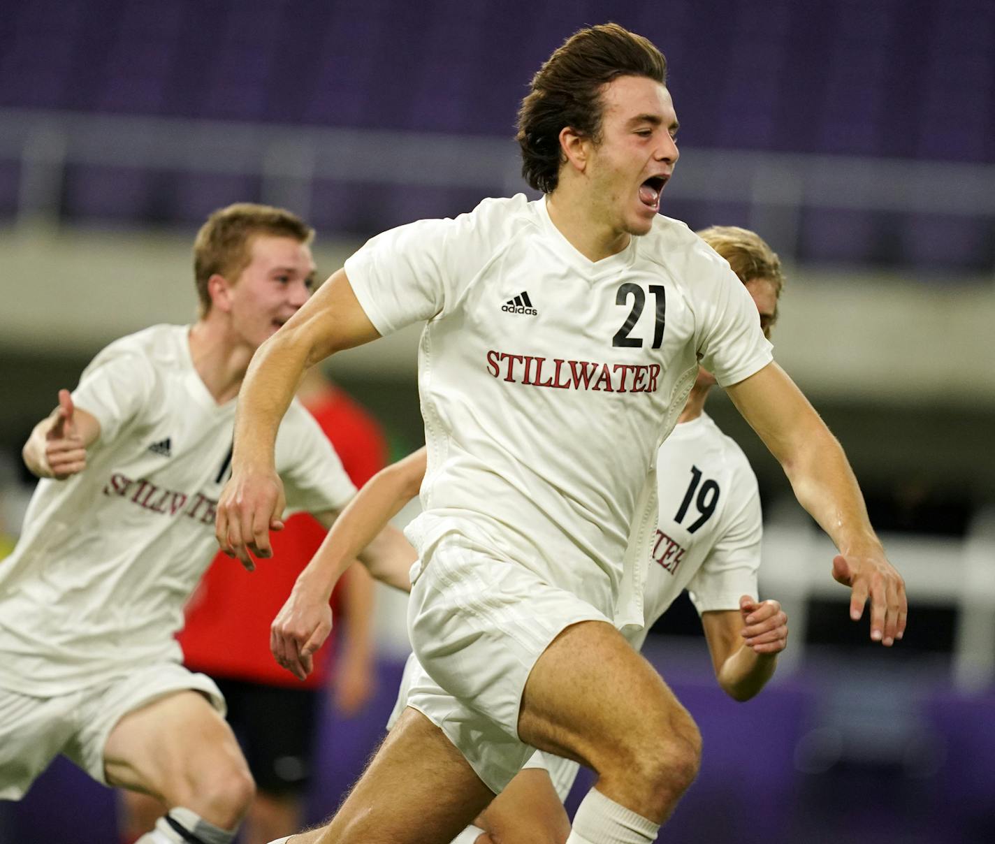 Stillwater's Spencer Scott (21) raced towards the Stillwater fan section in celebration after scoring the game winning goal in overtime. ] ANTHONY SOUFFLE &#xef; anthony.souffle@startribune.com Stillwater High School played Duluth East High School in a Class 2A boys' soccer championship match Friday, Nov. 2, 2018 at U.S. Bank Stadium in Minneapolis.