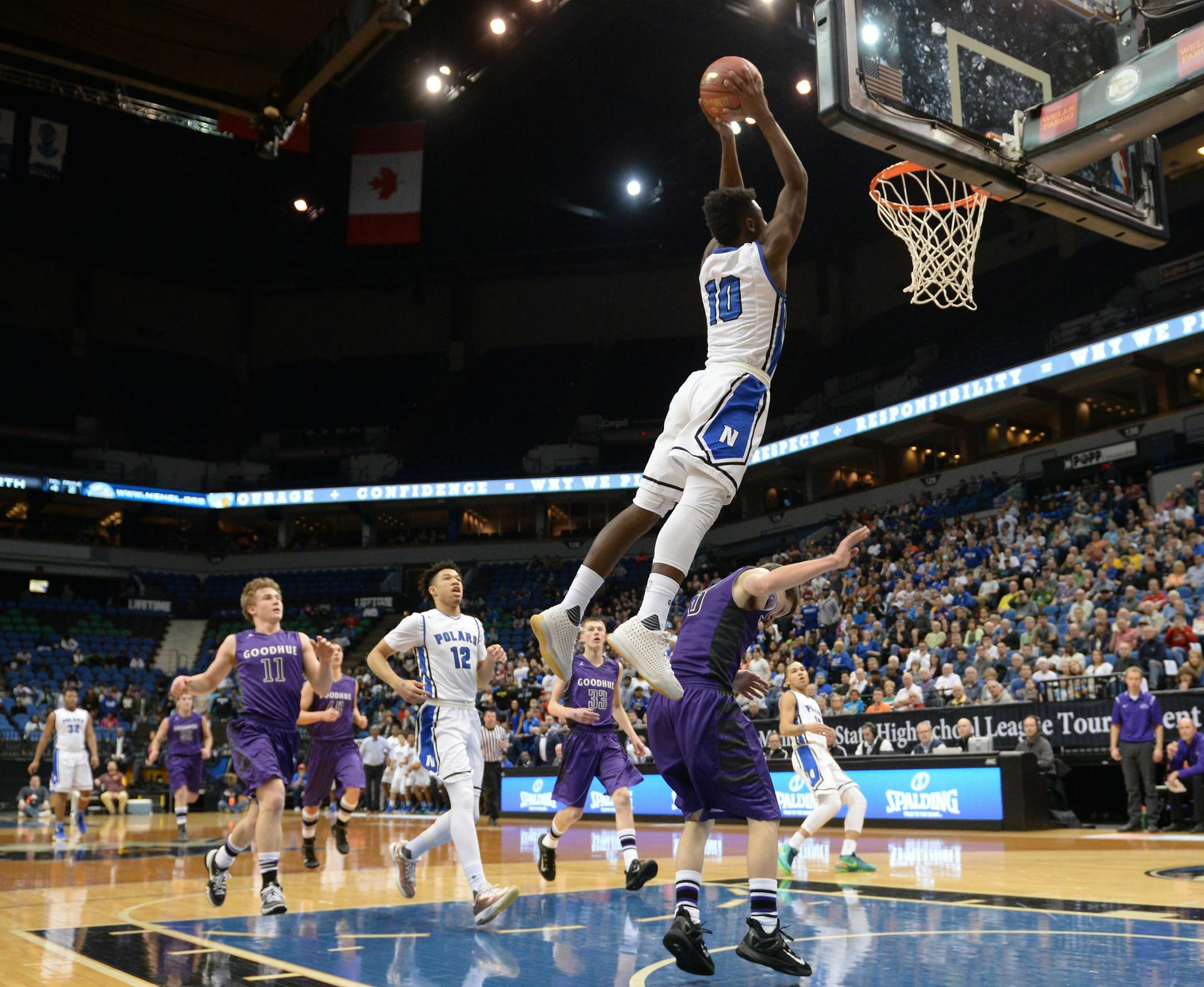 Minneapolis North guard Tyler Johnson (10) dunked the ball off an alley oop pass in the first half against Goodhue Saturday. ] (AARON LAVINSKY/STAR TRIBUNE) aaron.lavinsky@startribune.com Minneapolis North played Goodhue in the Class 1A boys’ basketball championship game on Saturday, March 12, 2016 at Target Center in Minneapolis, Minn.