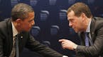 FILE -In this March 26, 2012 file photo, President Barack Obama talks with Russian President Dmitry Medvedev in Seoul, South Korea. President Barack O