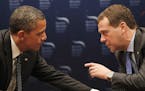 FILE -In this March 26, 2012 file photo, President Barack Obama talks with Russian President Dmitry Medvedev in Seoul, South Korea. President Barack O