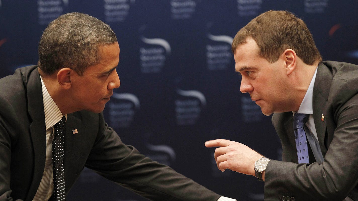 FILE -In this March 26, 2012 file photo, President Barack Obama talks with Russian President Dmitry Medvedev in Seoul, South Korea. President Barack Obama will play host this weekend to an extraordinary confluence of international summitry, with world leaders scuttling from the Maryland mountains to downtown Chicago as they grapple for fixes to Europe's mounting economic woes and solidify plans for winding down the decade-long war in Afghanistan. (AP Photo/Pablo Martinez Monsivais, File) ORG XMI