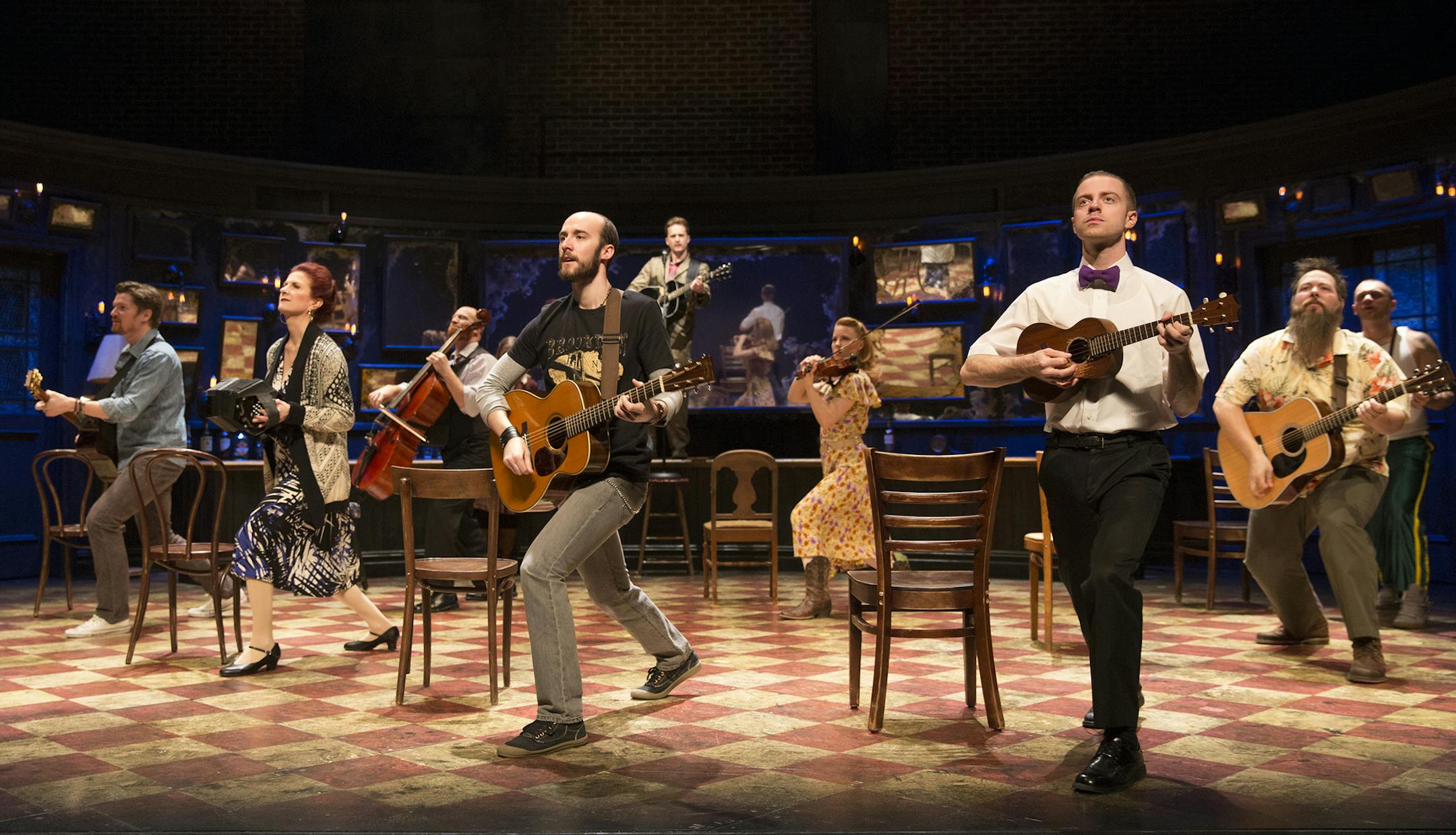 John Steven Gardner, left forefront in black T-shirt with guitar, in "Once." credit: Joan Marcus