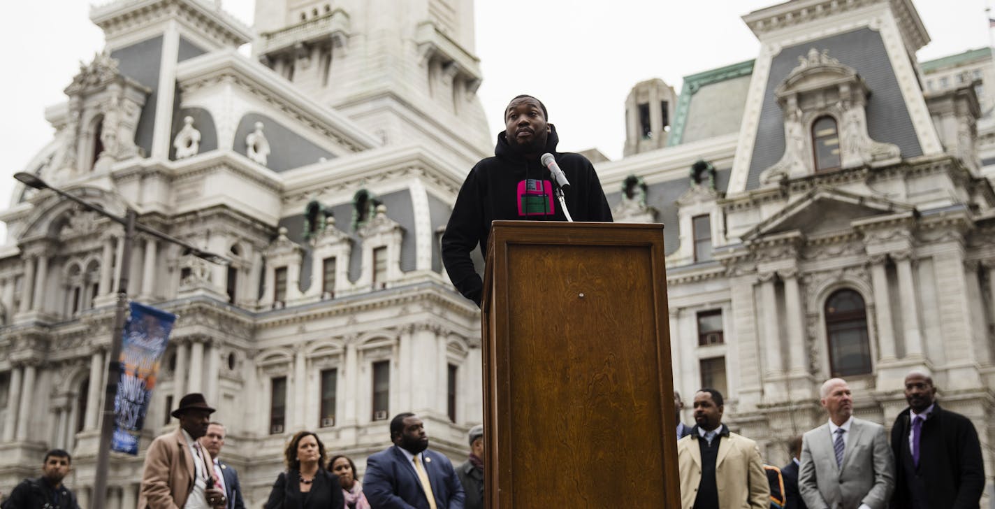 Recording artist Meek Mill speaks at a gathering to push for drastic changes to Pennsylvania's probation system, in Philadelphia, Tuesday, April 2, 2019. House Democratic Whip Jordan Harris on Tuesday announced he will soon introduce a bill designed to result in fewer people on parole and for shorter periods of time. (AP Photo/Matt Rourke)