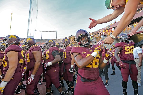 Minnesota Gopher players made their way to the field for pre-game warm-up before they took on Oregon State at TCF Bank Stadium,