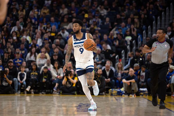 Minnesota Timberwolves guard Nickeil Alexander-Walker (9) brings the ball up court against the Golden State Warriors during the second quarter of an N