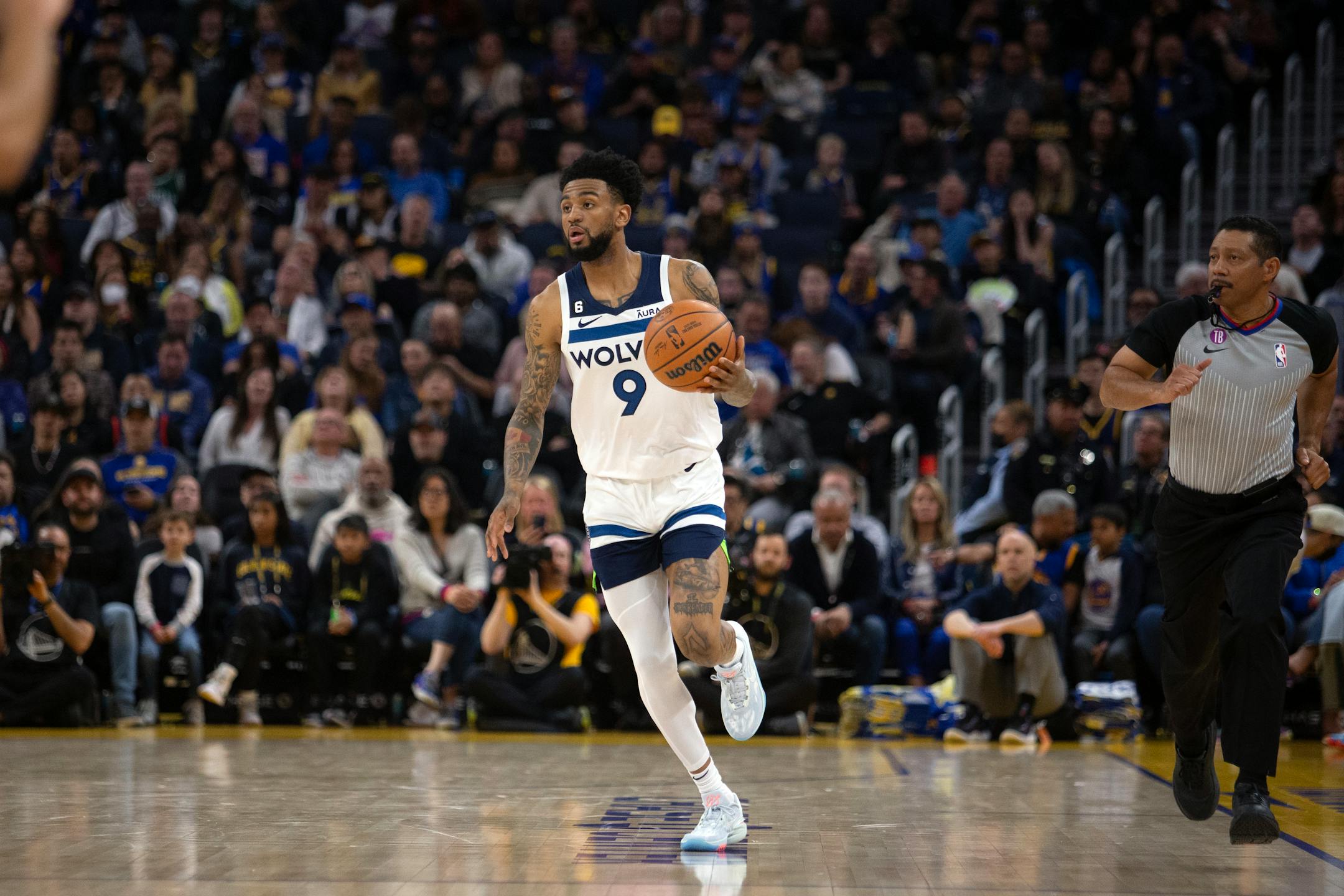 Minnesota Timberwolves guard Nickeil Alexander-Walker (9) brings the ball up court against the Golden State Warriors during the second quarter of an NBA basketball game, Sunday, March 26, 2023, in San Francisco. (AP Photo/D. Ross Cameron) ORG XMIT: CARC