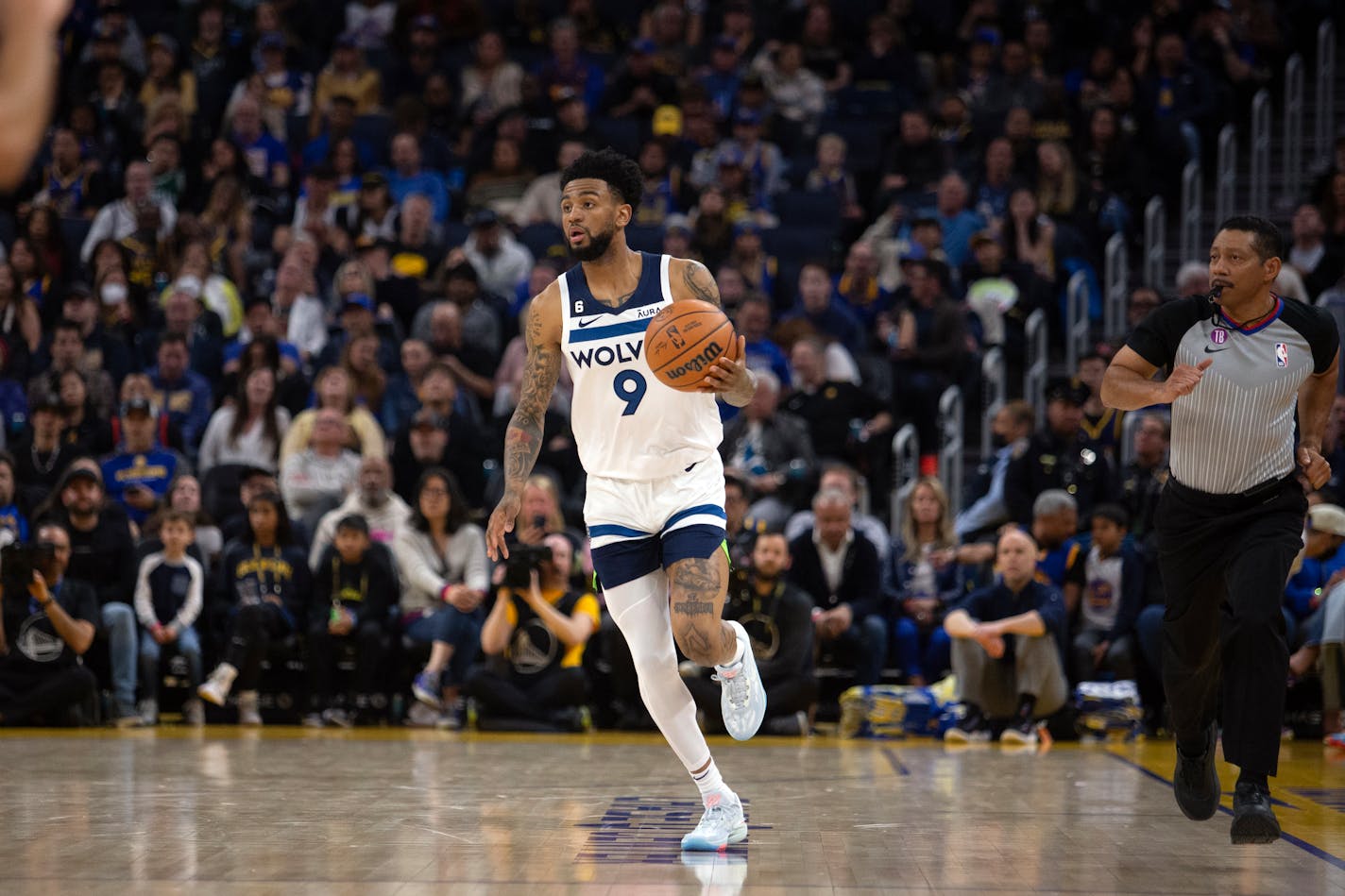 Minnesota Timberwolves guard Nickeil Alexander-Walker (9) brings the ball up court against the Golden State Warriors during the second quarter of an NBA basketball game, Sunday, March 26, 2023, in San Francisco. (AP Photo/D. Ross Cameron) ORG XMIT: CARC