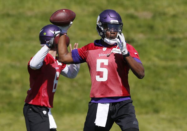 FILE - In this June 6, 2017, file photo, Minnesota Vikings quarterback Teddy Bridgewater throws a pass during the practice in Eden Prairie, Minn. One 