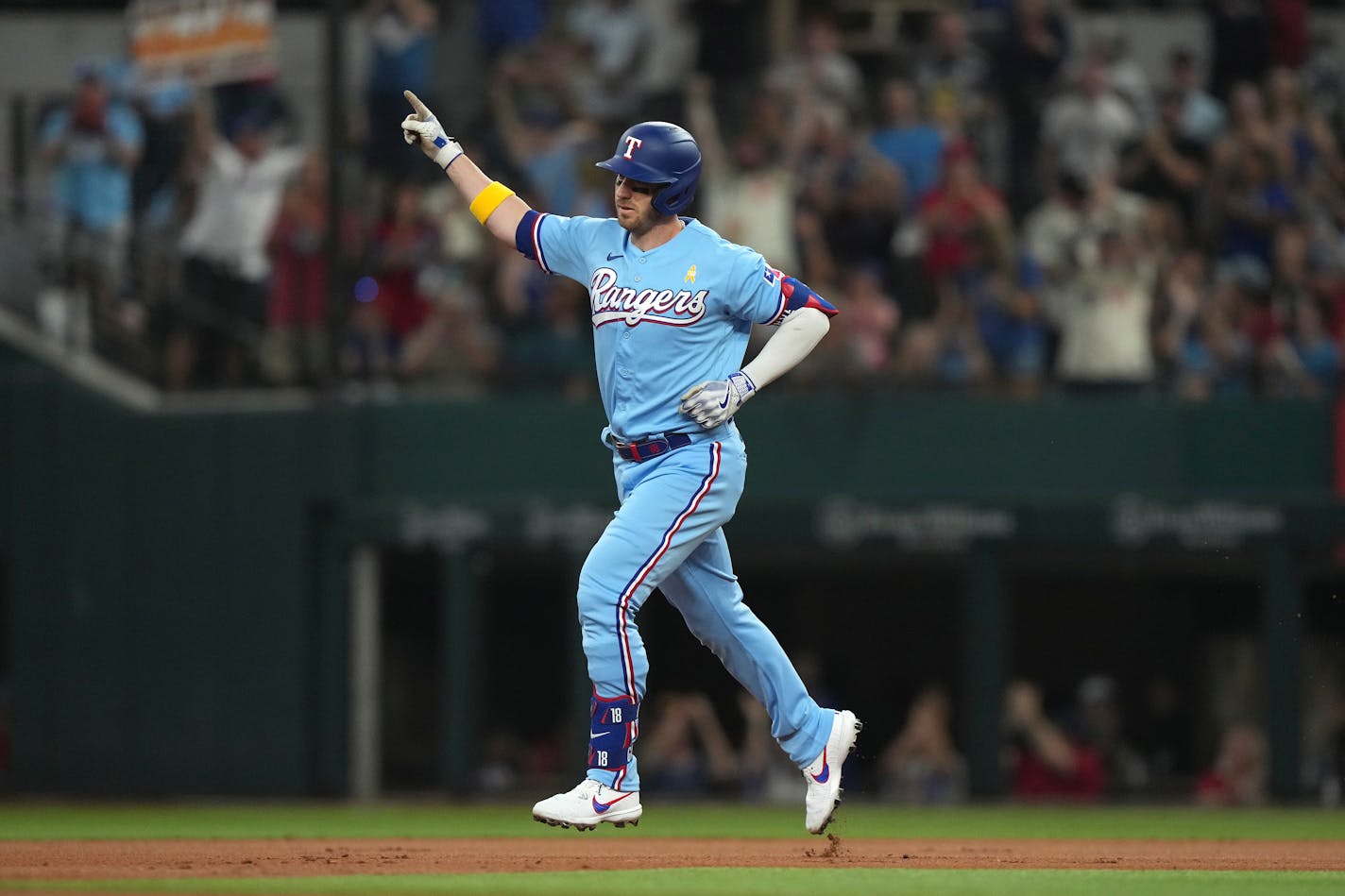 Texas Rangers' Mitch Garver runs the bases after hitting a home run that also scored teammates Corey Seager and Nathaniel Lowe during the first inning of a baseball game in Arlington, Texas, Sunday, Sept. 3, 2023. (AP Photo/LM Otero)