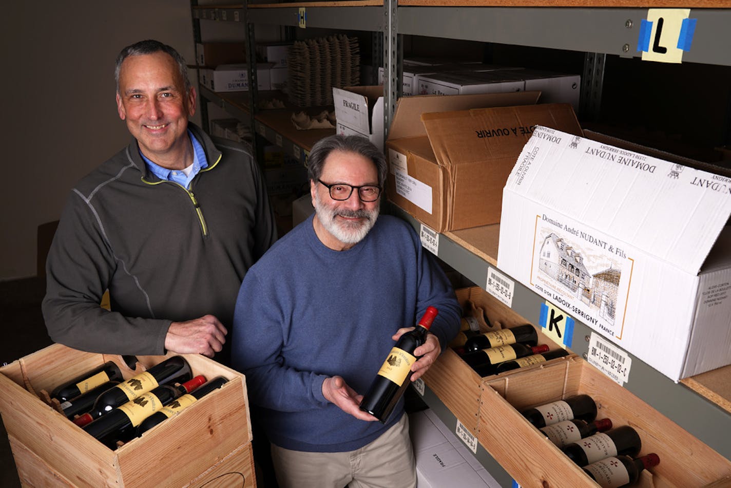 John Desteian, right, owner of Lompian Wines, a small importer of European wines, employs 10 people including operations manager Mark Mueller. Desteian's profits are down 25% from 2019, despite increasing prices. John Desteian, owner of Lompian Wines, a small importer of European wines, stood for a portrait among a selection of his French wines Tuesday, March 3, 2020 at his company's warehouse in Fridley, Minn. The 25% tariffs on wines from France, Germany, and Spain imposed by the Trump adminis