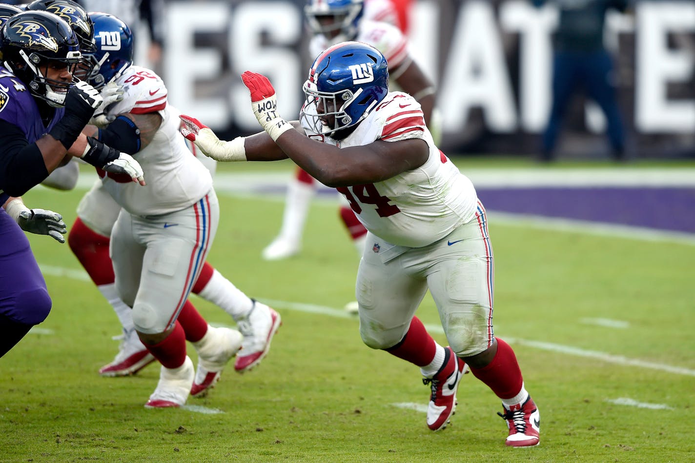 New York Giants nose tackle Dalvin Tomlinson rushes in against the Baltimore Ravens during the second half of an NFL football game, Sunday, Dec. 27, 2020, in Baltimore. The Ravens won 27-13. (AP Photo/Gail Burton)