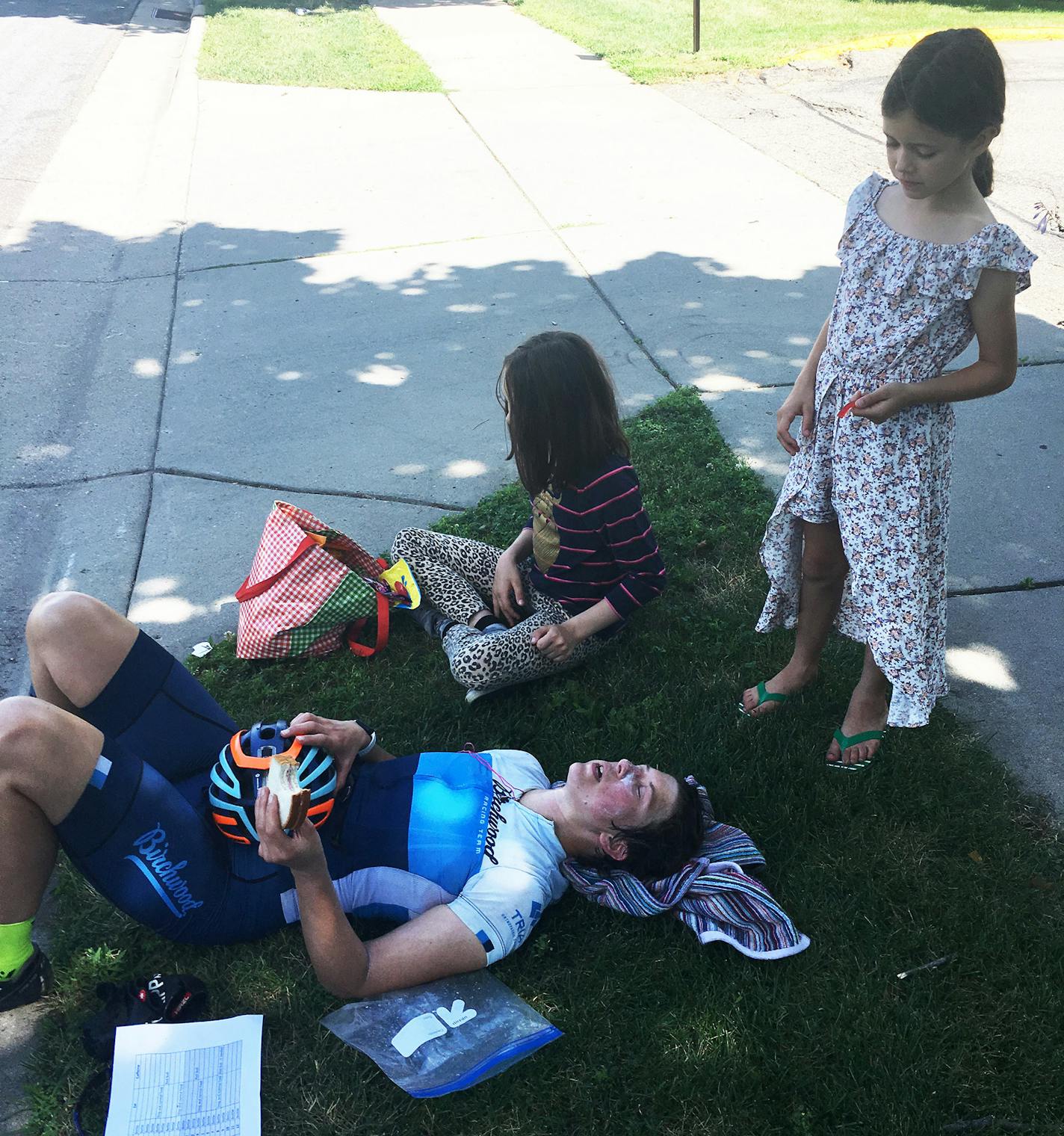 Alix Magner rested her body and got some nourishment during her road climb July 27. Her children Jasper and Juniper were ready with support.