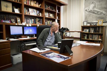 District Judge Rex Stacey put his head in his hand as he talked about his daughter and her artwork which was hanging up all around his office at the S