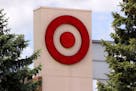 This May 3, 2017, photo shows the logo on a Target store in Upper Saint Clair, Pa. Target says it is buying delivery logistics company Grand Junction 