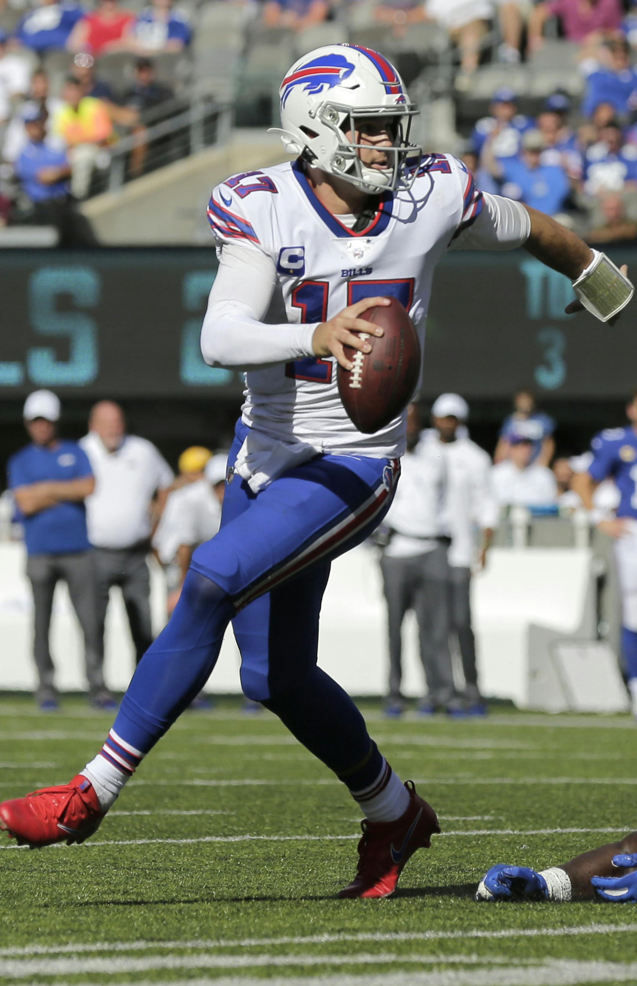 Buffalo Bills quarterback Josh Allen, left, evades New York Giants' Markus Golden during the second half of an NFL football game, Sunday, Sept. 15, 2019, in East Rutherford, N.J. (AP Photo/Adam Hunger) ORG XMIT: NYSW122