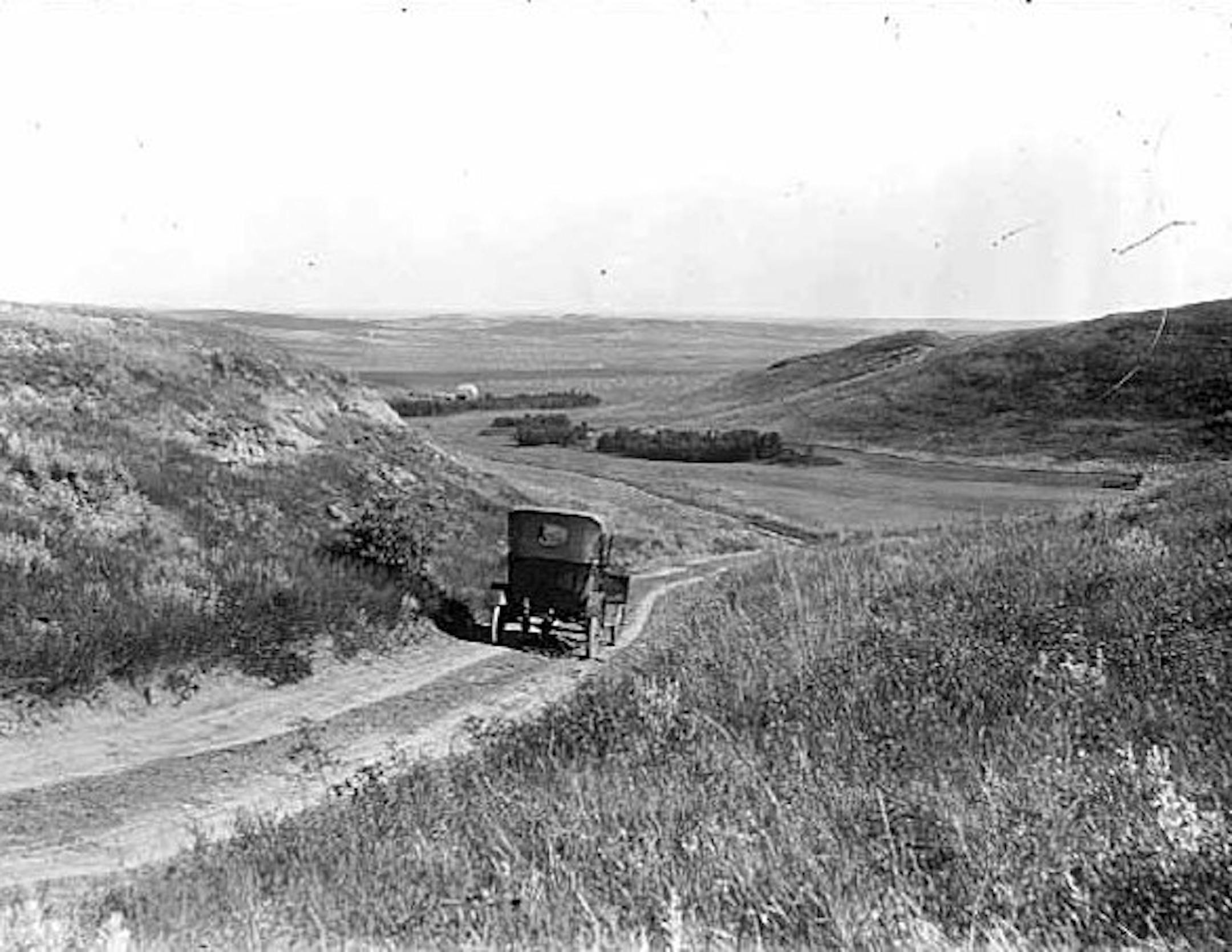A car travels on a road near Glen Lake in Minnetonka around 1920. Today, the hilly area is a mix of commercial and residential areas. Photo courtesy of Minnesota Historical Society.