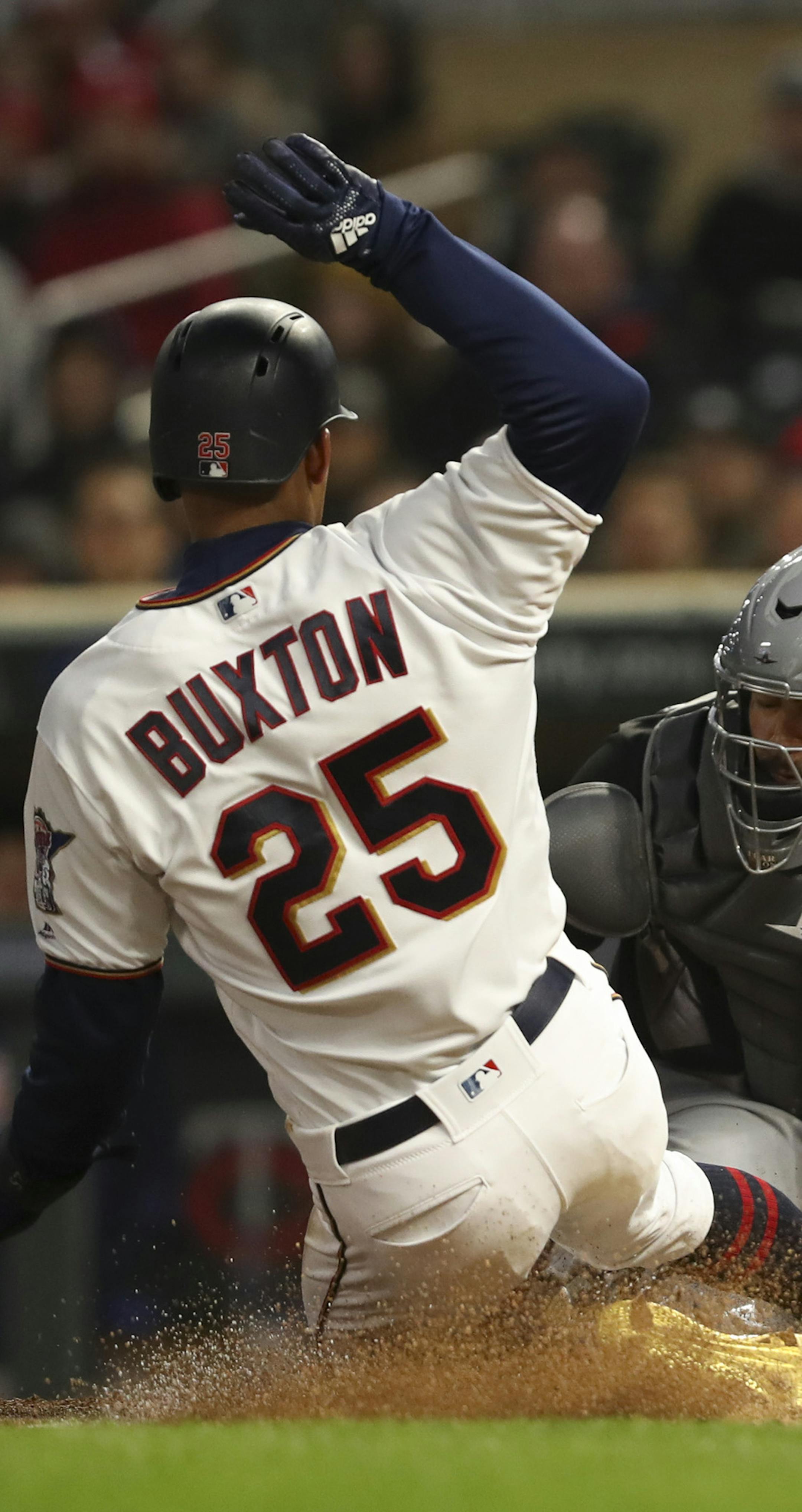 Minnesota Twins center fielder Byron Buxton (25) was safe at home when Chicago White Sox catcher Omar Narvaez (38) couldn't handle the throw from Chicago White Sox shortstop Tim Anderson (7) after he fielded a hit by Brian Dozier. ] JEFF WHEELER ï jeff.wheeler@startribune.com The Minnesota Twins faced the Chicago White Sox in an MLB baseball game Thursday night, April 12, 2018 at Target Field in Minneapolis.