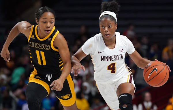 Minnesota Golden Gophers guard Jasmine Powell (4) took the ball down the court as Milwaukee Panthers guard Anaiah Moore (11) raced to defend in the se