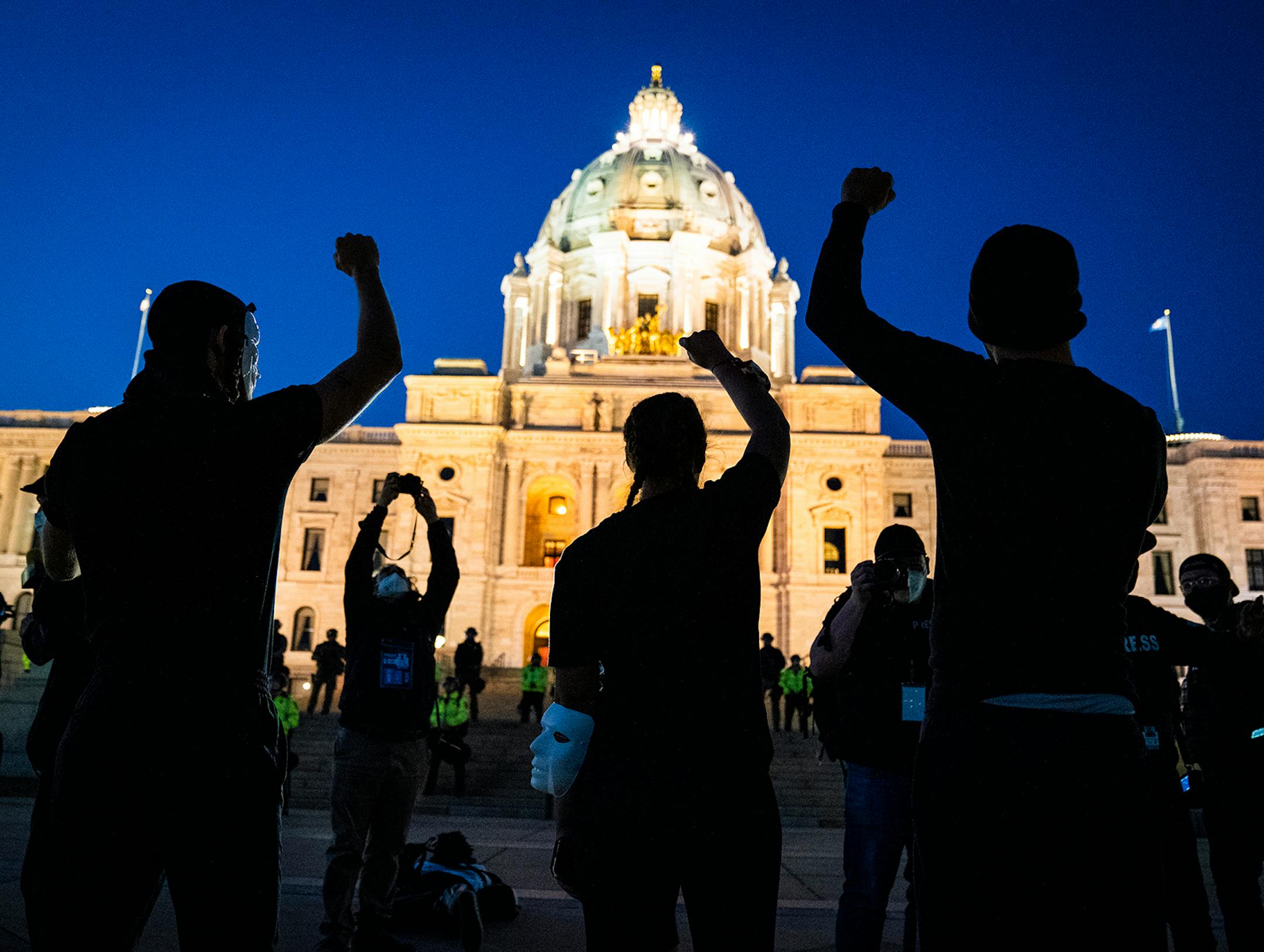 Families of those killed by police marched with hundreds of supporters in "The Secret March" down University Avenue to the Capitol in St. Paul. There they dropped several effigies of dead bodies and coffins along with a list of demands.