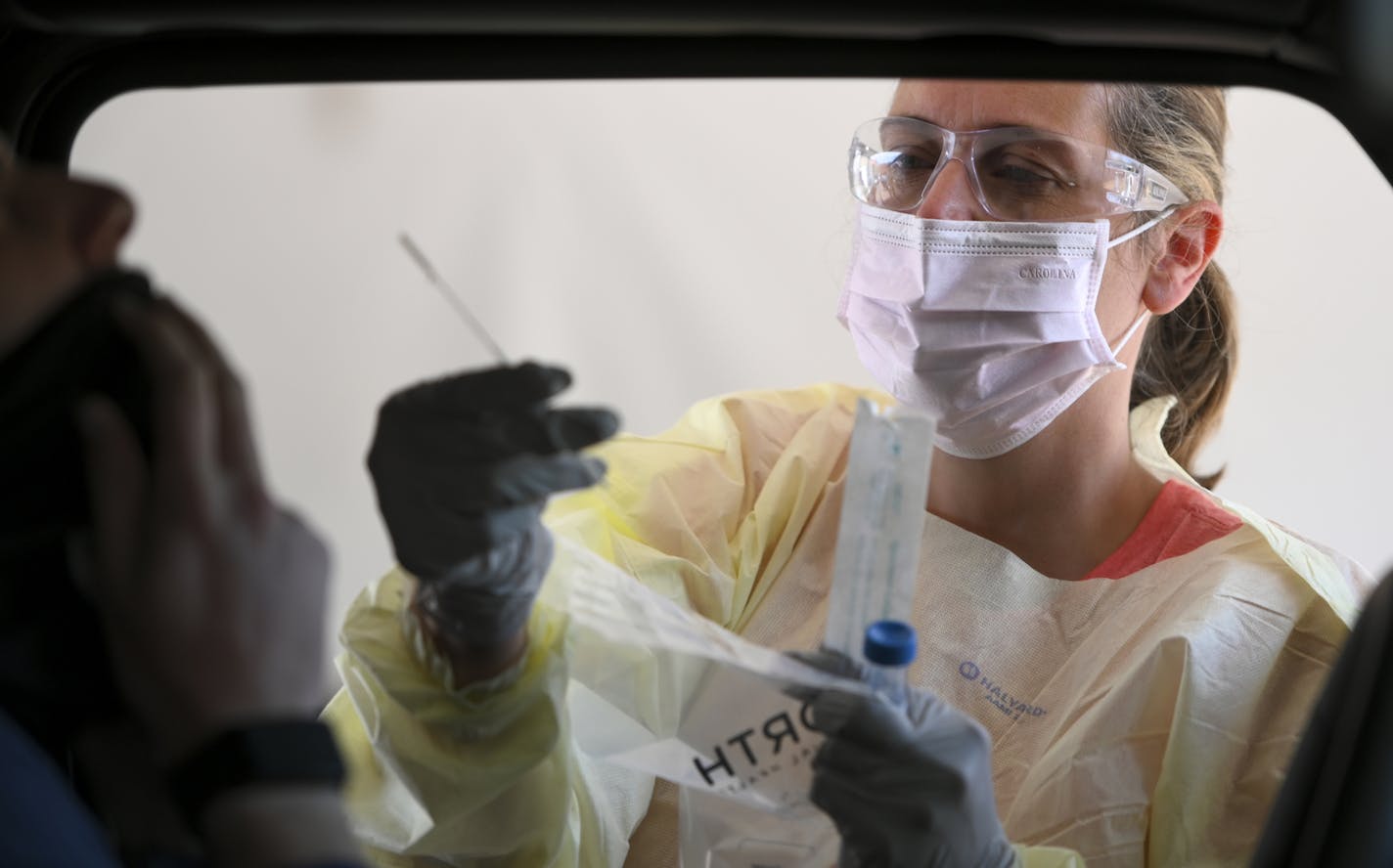 North Memorial RN Andrea Driskill administered COVID-19 tests to drive-up patients July 29 behind the North Memorial Specialty Center in Robbinsdale.