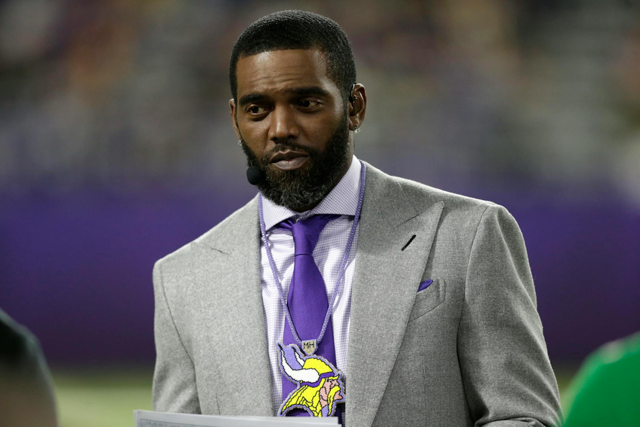 ESPN Monday Night Countdown personality Randy Moss stands on the field before an NFL football game between the Minnesota Vikings and the Green Bay Packers, Monday, Dec. 23, 2019, in Minneapolis.