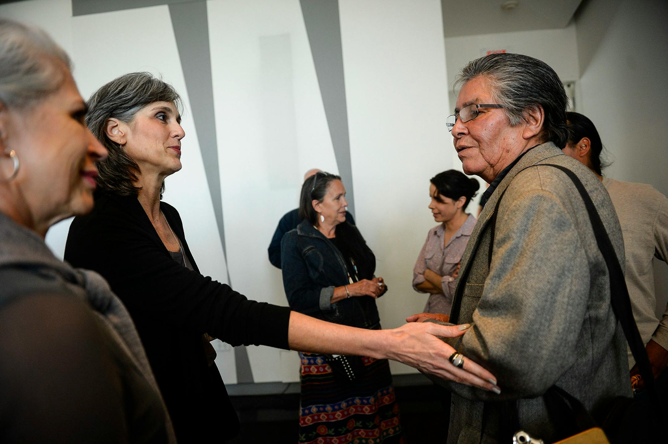 In May, Walker Art Center director Olga Viso touched the arm of Dakota elder Sheldon Wolfchild as they parted ways following a press conference at the Walker Art Center.