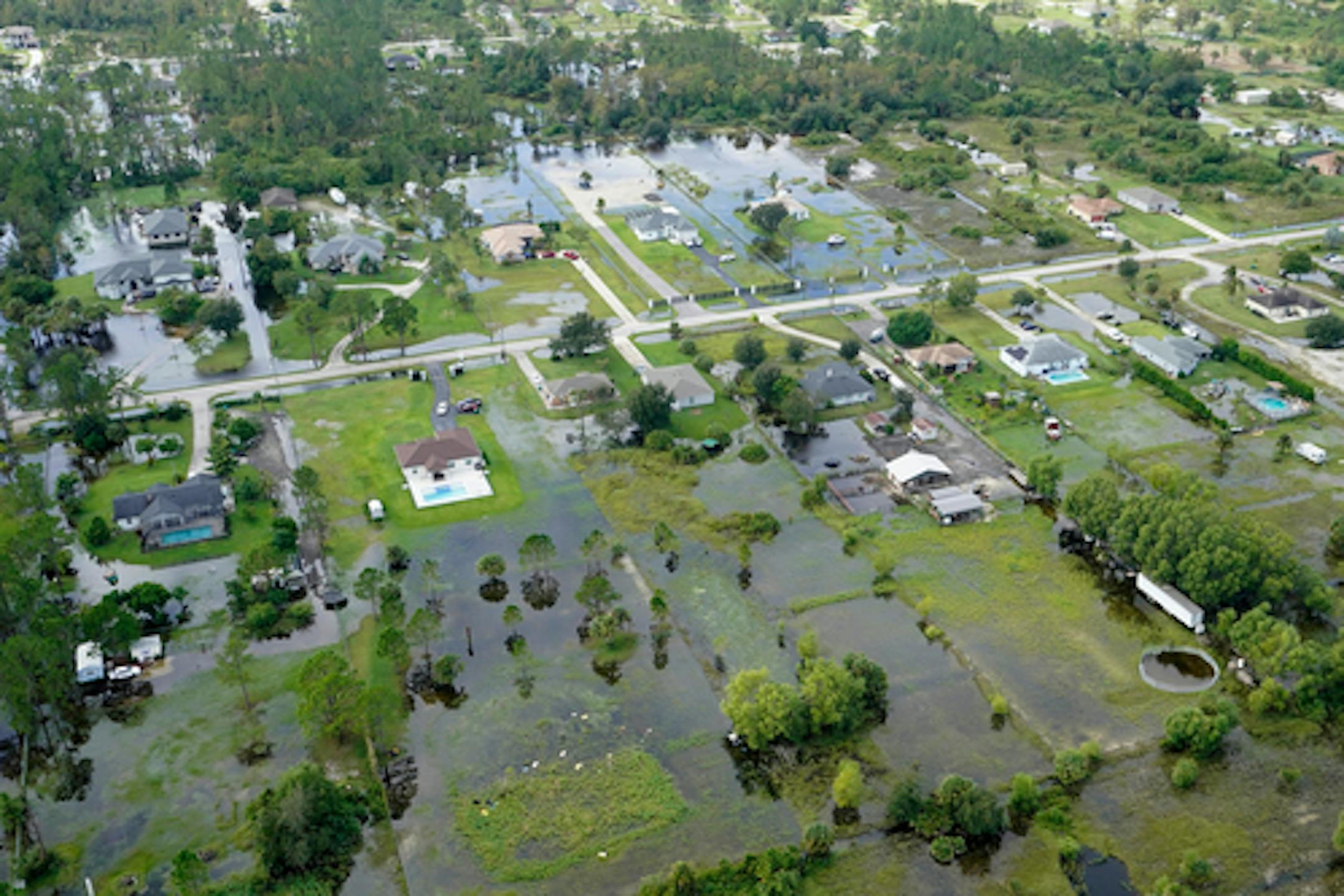 Flooded home homes and buildings are shown in the aftermath of Hurricane Ian, Thursday, Sept. 29, 2022, near Naples, Fla. (AP Photo/Wilfredo Lee)